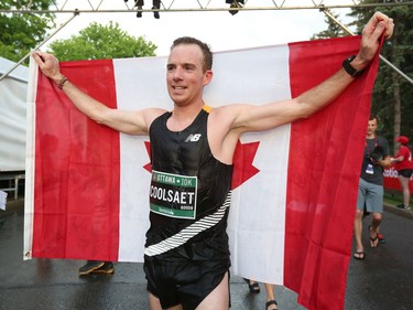 Reid Coolsaet is the first Canadian man to cross the finish line in the 10K run with a time of 30:19.0.