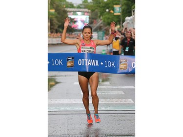 Lanni Marchant is the first Canadian woman to finish her 10K run.