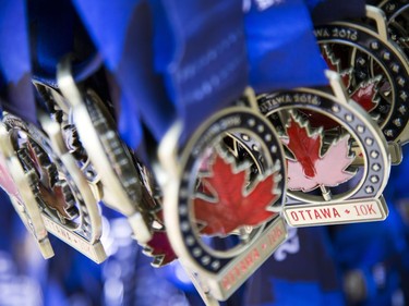 The 10k medals await the winners at the finish line on Saturday, May 28, 2016.