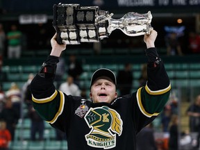 Max Jones #49 of the London Knights (OHL) hoists the Memorial Cup after defeating the Rouyn-Noranda Huskies (QMJHL) during the Memorial Cup Final on May 29, 2016 at the Enmax Centrium in Red Deer, Alberta, Canada.