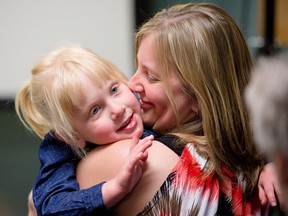 Five-year-old Abby Dalgleish and her mother Christine Dalgleish attend a news conference on Tuesday, May 17 where the amalgamation of Children's Hospital of Eastern Ontario and Ottawa Children's Treatment Centre was announced.