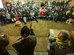 Auctioneer John Joynt urges onlookers to bid at the Oxford-on-Rideau Bird Club auction held Saturday in South Mountain.