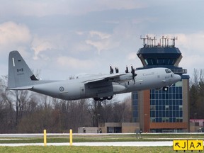 A Canadian Forces CC-130J Hercules transport aircraft takes off from the airstrip at CFB Trenton in Trenton, Ont., on Wednesday, May 4, 2016.
