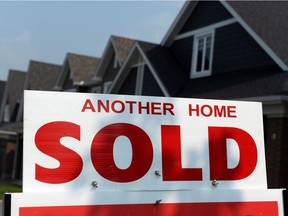 A for sale sign displays a sold home.