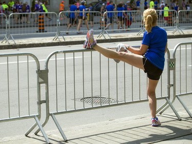 A runner stretches out  before the races started Saturday, May 28, 2016 at Tamarack Ottawa Race Weekend.