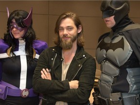 Actor Tom Payne (C) poses with cosplayers during the Comiccon press conference at city hall featuring actors John Rhys-Davies (Lord of the Rings), Tom Payne (The Walking Dead), Carl Weathers (Rocky, Predator), Lou Ferrigno (Hulk), Billy Dee Williams (Star Wars: The Empire strikes back), Tia Carrere (Wayne's World, Relic Hunter, Lilo & Stitch), René Auberjonois (Star Trek: Deep space nine) and John De Lancie (Star Trek).
