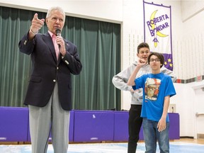 Alex Trebek, host of Jeopardy!, left, speaks to students during a geography challenge Tuesday.
