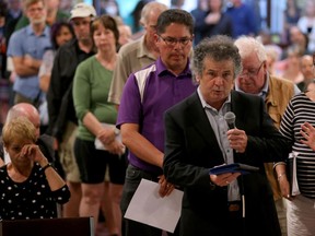 Architect Jean Emmell complains about the lack of transparency during the planning process as a line formed out the doors to ask questions following the presentation. More than 250 people showed up - filling Riverside United Church to standing-room only - Tuesday evening (May 31,2016) to hear the City of Ottawa's consultation session on the Mooney's Bay Park Playground. The playground is to be Canada's largest and will be featured in a TVO reality show while it's being built for Canada's 150th birthday in 2017.