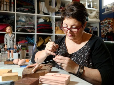 Artist Maria Saracino (left) has made statuettes of a number of people from Ottawa's fashion scene.