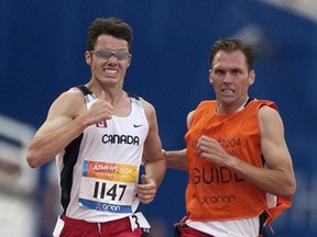 Ottawa's Jason Dunkerley, left, a five-time Paralympic medallist, was one of the 'angels' that helped give Henry Cardenas Cerdas the chance to be part of Ottawa Race Weekend.