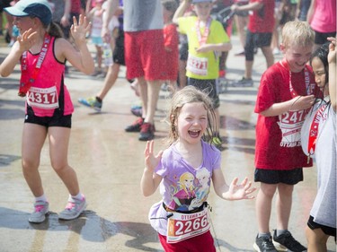 Camille Lariviere cools off after running the 2K race.