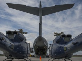 Members from Canadian Forces Base Trenton prepare to load three CH-146 Griffon helicopters into a CC-177 Globemaster aircraft at CFB Trenton, Ontario, May 4, 2016.

Photo: Corporal Ken Beliwicz, 8 Wing Imaging
TN12-2016-0345-010