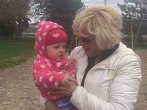 Canadian Army Reserve Captain Kellie Brennan with the youngest of her eight children.