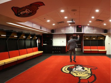 Ottawa Senator Chris Phillips leaves his old dressing room.