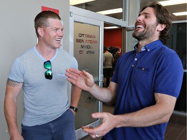 Ottawa Senator Chris Neil and former Ottawa Senator Mike Fisher have a laugh before the press conference at the Canadian Tire Centre.