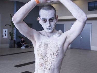 Chris Rosales attended Comiccon on Friday dreassed as Nux from the film Mad Max: Fury Road. His girlfriend did his makeup. (Bruce Deachman, Ottawa Citizen)