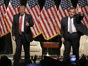 In this March file photo, Republican presidential candidate Donald Trump gives a thumbs up as New Jersey Gov. Chris Christie waves to the crowd after a rally at Lenoir-Rhyne University in Hickory, N.C.