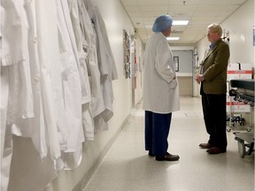 Dr. Pierre Bedard, left, chatting with Dr. Keon, recalls how he thought Keon was "crazy" for suggesting a heart institute In Ottawa.