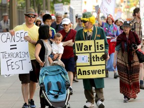 Protesters demonstrated in downtown Ottawa against the CANSEC 2016 military equipment trade show. On Thursday morning protesters moved to the EY Centre where CANSEC is being held.
