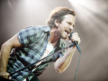 Eddie Vedder, lead singer of Pearl Jam, leans into his performance at the Canadian Tire Centre on Sunday, May 8, 2016.