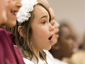 Emma Eddy-Saikal, from Dr. F.J. McDonald Catholic School, sings with a group of about 400 students from 100 Ottawa schools at Woodroffe High School in celebration of Music Monday, Monday May 02, 2016.