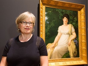 Erika Dolphin, Associate Curator, discusses The White Dress, an exhibition that highlights the evolution of the infamous chemise garment and other radical transformations in fashion at the turn of the 18th century. The signature piece of art beside her is by Anne-Louis Girodet. (WAYNE CUDDINGTON) Assignment - 123782