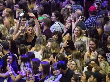 Fans enjoy themselves as Carrie Underwood (not shown) performs during The Storyteller Tour – Stories in the Round, at Canadian Tire Centre,  in Ottawa on May 27, 2016.