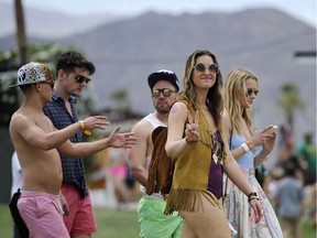 Coachella festivalgoers arrive on day one of the 2014 Coachella Music and Arts Festival in Indio, Calif.