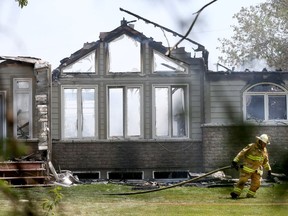 A car and garage fire left a home destroyed on Empire Grove Street in Ottawa Tuesday May 24, 2016. Two dogs were destroyed in the fire.  Tony Caldwell