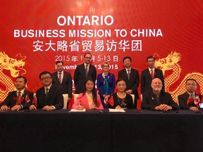 Premier Kathleen Wynne visited Shanghai on a November trade mission and posed for pictures with executives from the embattled Canadian International Academy.