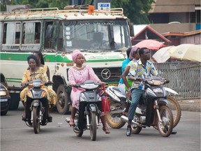 Ghanaians ride motorbikes in the traffic chaos in the northern Ghana city of Tamale. Abdul-haqq Mahama, Tamale, GHANA