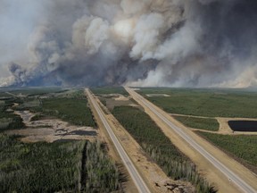 Aerial view of highway 63 south of Fort McMurray taken from a CH-146 Griffon helicopter on May 5, 2016. The Canadian Armed Forces have air assets deployed in support of the Province of Alberta's wildfire emergency response efforts.

Photo by: MCPL VanPutten, 3 CSDB Imaging
EN2016-0060-23
~
Photo aérienne de l’autoroute 63 au sud de Fort McMurray prise à bord d’un hélicoptère CH-146 Griffon, le 5 mai 2016. Les Forces armées canadiennes déploient des ressources aériennes à l’appui des mesures d’urgence prises par la province de l’Alberta en vue de combattre les feux de forêt.

Photo : Cplc VanPutten,  Services d’imagerie, BS 3 Div C
EN2016-0060-23