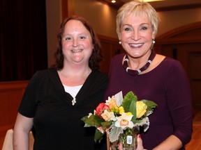 From left, Ancoura resident Joanne Benedict presented guest speaker Barbara Crook with flowers at a fundraising dinner held at the St. Elias Centre on Thursday, May 5, 2016, for Ancoura, a volunteer-driven charity group that provides housing and community support to people living with mental illness.