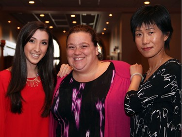 From left, volunteer Selin Kum with Lindy Rosko, board president of The Rehabilitation Centre Volunteer Association, and volunteer Pulan Wang at the 17th annual Spring into Motion charity auction and dinner, held Wednesday, May 18, 2016, at the St. Elias Centre.