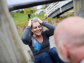 Gillian Bryenton does sit-ups at Sue Holloway fitness park. She was part of a protest this week over the city's plan to build a mega-playground in Mooney's Bay Park.