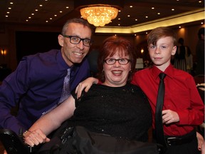 Guest speaker and double amputee Karen Toop, former patient of The Ottawa Hospital Rehabilitation Centre, with her husband, Harvey, and their son, Ryan, nine, at the 17th annual Spring Into Motion charity auction and dinner held at the St. Elias Centre on Wednesday, May 18, 2016.