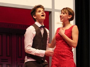 J. Pierrepont Finch, played by Robbie Zwierzchowski, left, and  Rosemary Pilkington, played by Veronica Simpson  in Woodroffe High School's Cappies production of How to Succeed in Business Without Really Trying.