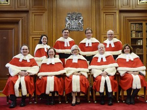 The Supreme Court justices pose for a group photo during the official welcoming ceremony for Supreme Court of Canada Justice Russell Brown at the Supreme Court in Ottawa on Tuesday Oct. 6, 2015. Justice Rosalie Abella gave a speech recently on democracy in Israel.