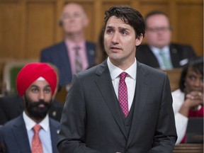Prime Minister Justin Trudeau looks to the public gallery as he formally apologizes for a 1914 government decision that barred most of the passengers of the Komagata Maru from entering Canada, in the House of Commons on Parliament Hill in Ottawa on Wednesday, May 18, 2016.