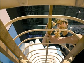 Eric McNair-Landry works on building a kayak by hand at the Canadian Museum of Nature in Ottawa Thursday May 12, 2016.