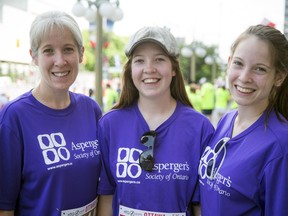 Alexandra Prefasi, left, 17-year-old Taylor Prefasi-Horning and 15-year-old Peyton Prefasi-Horning at the Tamarack Ottawa Race Weekend on Saturday. The family ran to support those with Asperger's, such as Taylor.