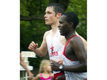 Ottawa's Jason Dunkerley, left, is seen with his guide runner during the 10K race.