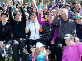 LPGA Tour player Brooke Henderson (centre in white, beside local golf instructor and host, Kevin Haime) was at Eagle Creek Golf Course in Dunrobin Tuesday with her sister and caddy, Brittany Henderson (centre right, in purple), giving a clinic for junior golfers.