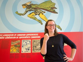 Meaghan Scanlon, Special Collections Librarian for Library and Archives Canada, does her best “Alter Ego” pose in front of Nelvana of the Northern Lights, a 1945 Canadian comic book hero created by Adrian Dingle.