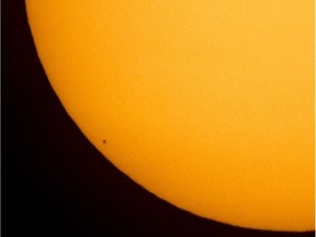 In this handout provided by NASA, the planet Mercury is seen in silhouette, lower left of image, as it transits across the face of the sun on May 9, 2016.