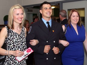 Ottawa firefighter Jeremy Flinter and his colleagues escorted the ladies to their dinner tables at the 10th annual Girls Night Out fundraiser for Hospice Care Ottawa, held at Algonquin College on Friday, May 27, 2016.