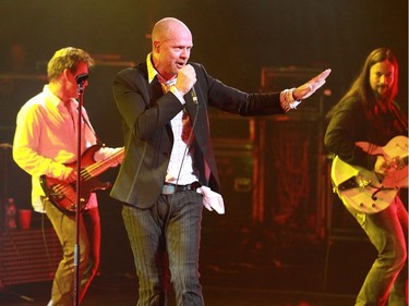 (L to r) Gord Sinclair on bass, lead vocalist of The Tragically Hip, Gord Downie and Rob Baker on guitar at the National Arts Centre in Ottawa on September 26, 2009.