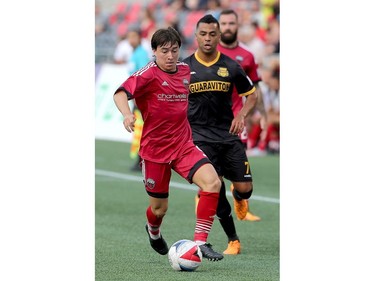 Ottawa's Bryan Olivera gets control of the ball to take it down the field.