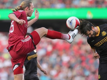 Ottawa's Lance Rozenboom's boot almost connects with the head of Fort Lauderdale's Dalton in front of the net.