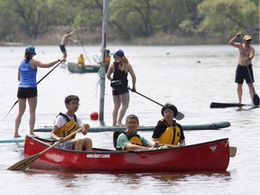 Paddlers take part in Paddlefest at Mooney's Bay beach in Ottawa on Saturday, May 28, 2016.  (Patrick Doyle)  ORG XMIT: Paddlefest05
